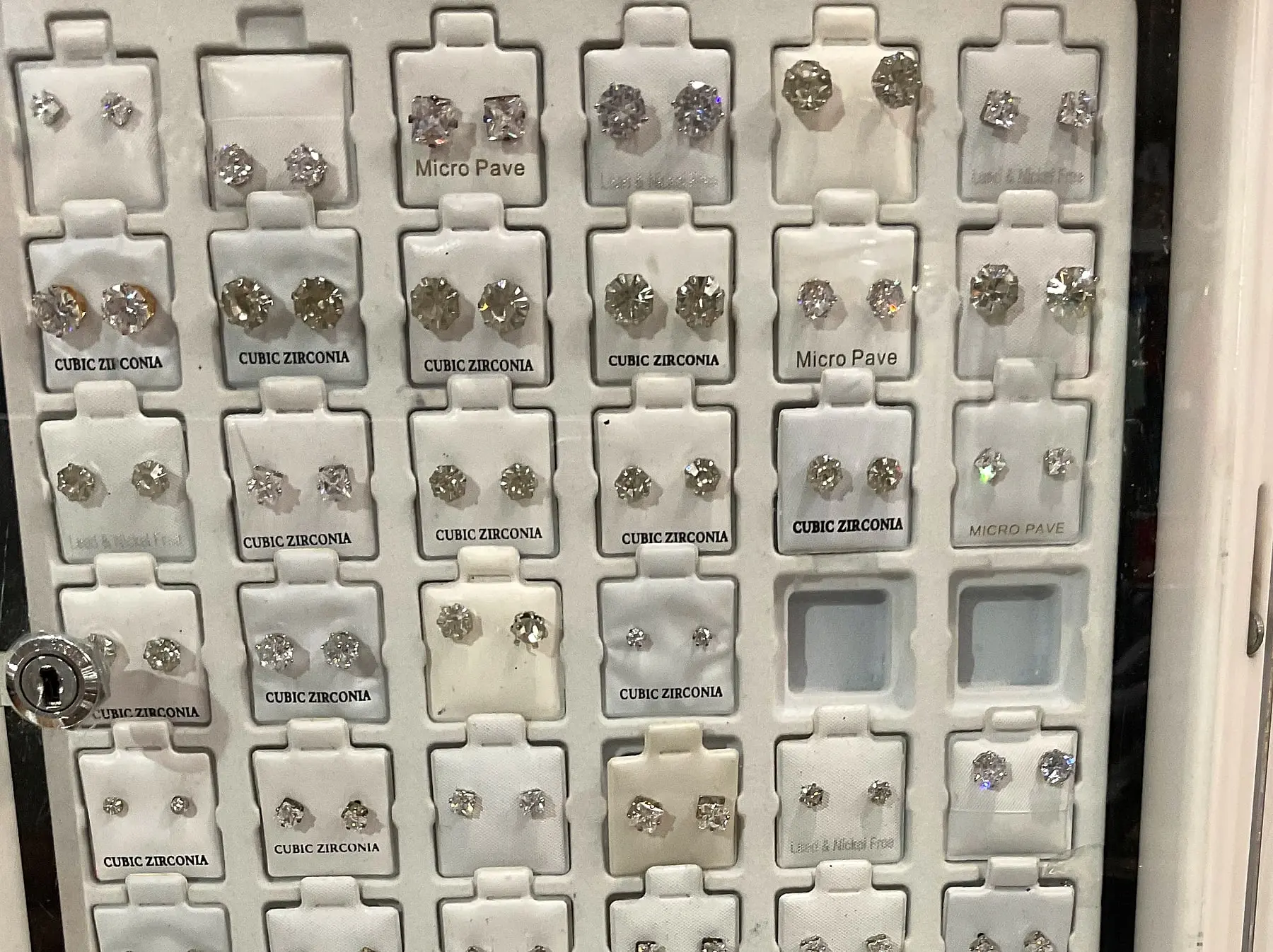 A tray of cubic zirconia stud earrings