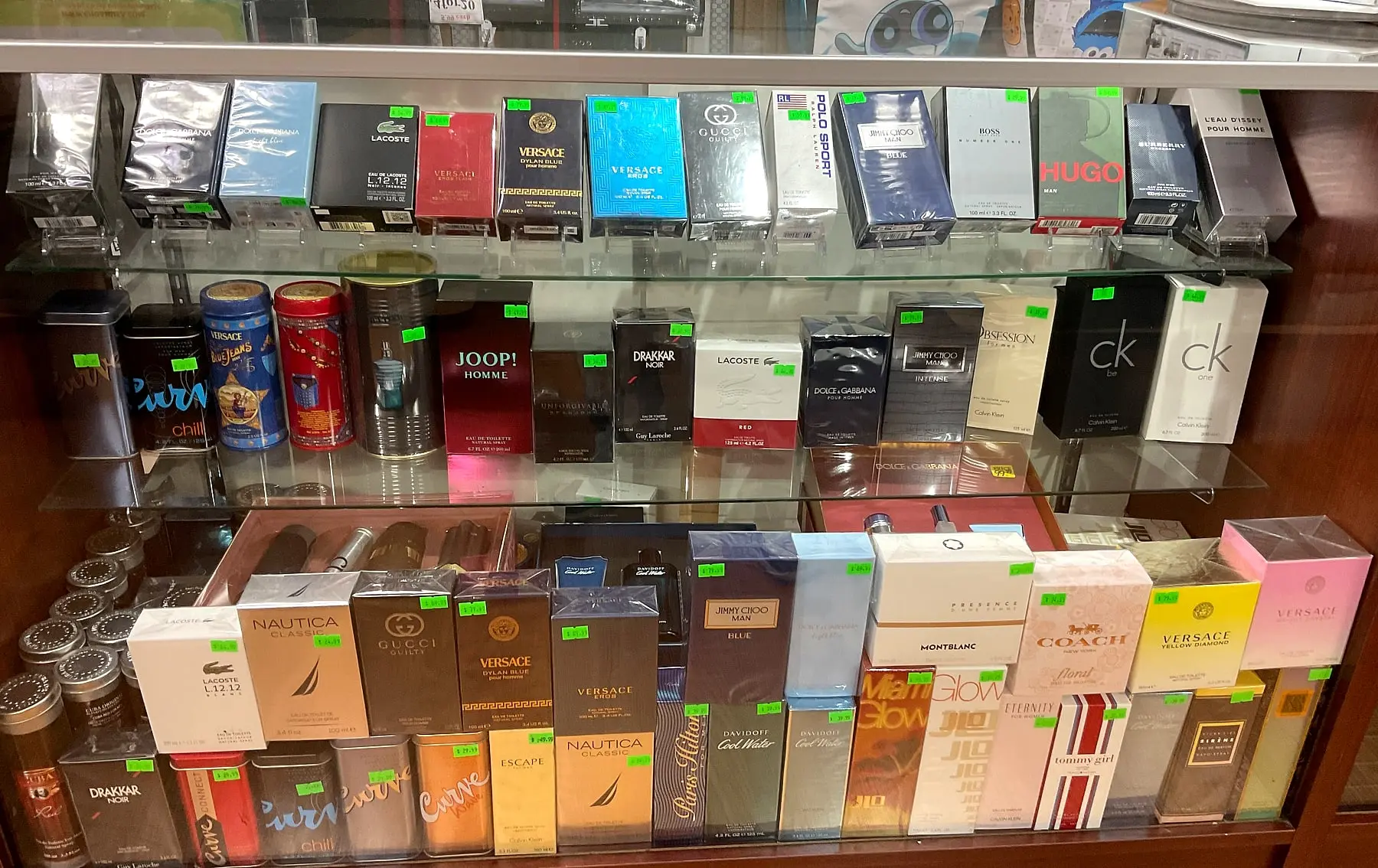 Designer fragrances in a glass display case