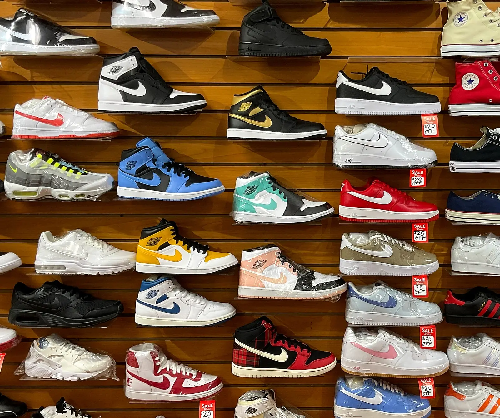 A wall of Nike and Jordan sneakers with red sale tags